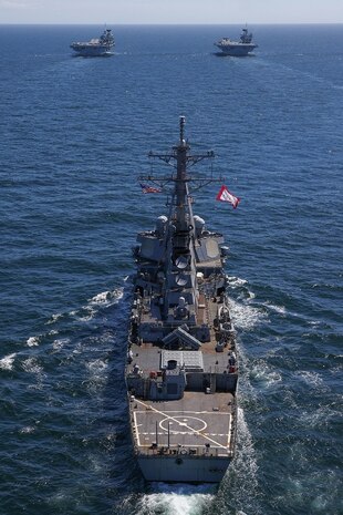 HMS Prince of Wales and HMS Queen Elizabeth pictured at sea for the first time with USS The Sullivans.