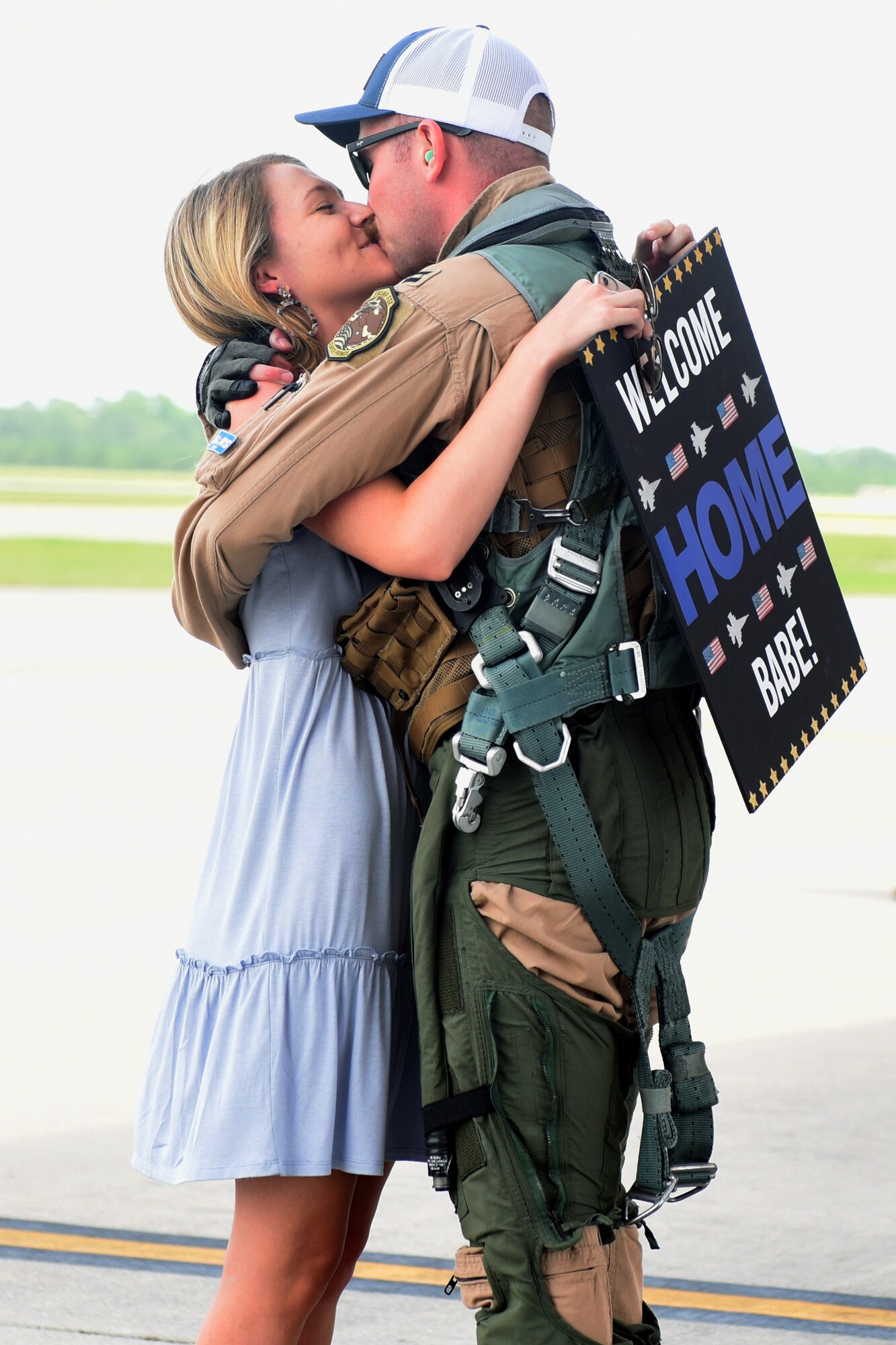 U.S. Air Force Capt. Kaleb Nypaver, a 157th Fighter Squadron pilot, greets his loved one at McEntire Joint National Guard Base, South Carolina, after returning from a deployment to Prince Sultan Air Base, Kingdom of Saudi Arabia, July 16, 2021. “Swamp Fox” Airmen from the South Carolina Air National Guard’s 169th Fighter Wing were deployed to PSAB for the past three months to project combat power and help bolster defensive capabilities against potential threats in the region. (U.S. Air National Guard photo by Senior Airman Mackenzie Bacalzo, 169th Fighter Wing Public Affairs)