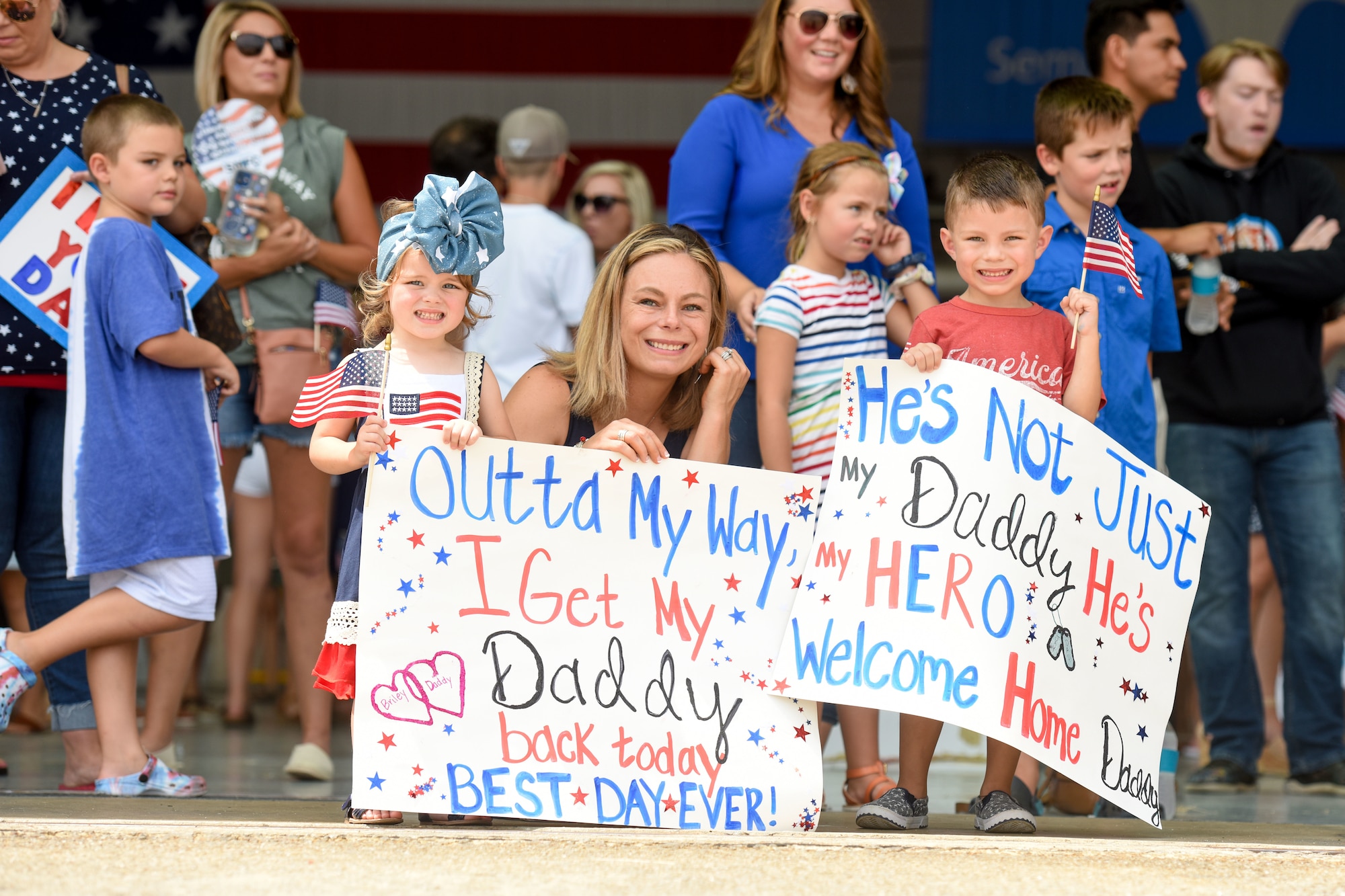 Friends and family of U.S. Air Force personnel recently deployed to Prince Sultan Air Base, Kingdom of Saudi Arabia, gather to celebrate their return home July 18, 2021 to the 169th Fighter Wing at McEntire Joint National Guard Base, South Carolina. "Swamp Fox" Airmen from the South Carolina Air National Guard’s 169th Fighter Wing were deployed to PSAB for the past three months to project combat power and help bolster defensive capabilities against potential threats in the region. (U.S. Air National Guard photo by Tech. Sgt. Megan Floyd, 169th Fighter Wing Public Affairs)