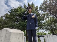 Maj. Steven Rein, Chaplain 11th Wing Operation Group, salutes the gravesite of a fallen Veteran at Arlington National Cemetery, Arlington, Virginia, June 11, 2021. The Arlington National Cemetery Chaplain Corps, under the 11th Wing Operation Group at Joint Base Anacostia-Bolling, serves at Arlington National Cemetery. The Chaplains provide religious rites and services for Air Force members and their families (U.S. Air Force photo by Brian Nestor)