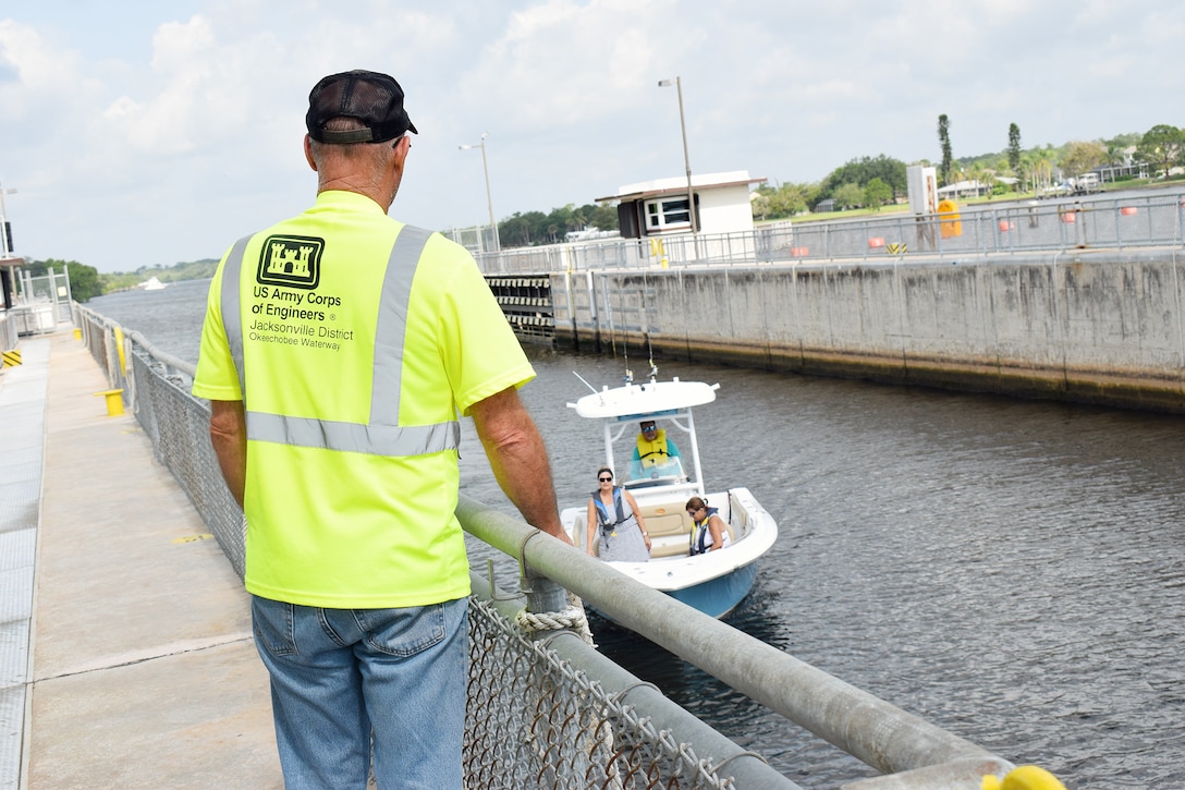 U.S. Army Corps of Engineers Jacksonville District manages and operates several lock and dams on its waterways. Pictured (left) is Glenn Huston, one lock operator pulling the rock for a small boat to lock into the chamber for 20 minutes as water is released from the Caloosahatchee River in Alva, Florida on April 25, 2021.