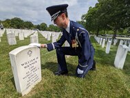 Maj. Steven Rein, Chaplain 11th Wing Operation Group, salutes the gravesite of a fallen Veteran at Arlington National Cemetery, Arlington, Virginia, June 11, 2021. The Arlington National Cemetery Chaplain Corps, under the 11th Wing Operation Group at Joint Base Anacostia-Bolling, serves at Arlington National Cemetery. The Chaplains provide religious rites and services for Air Force members and their families (U.S. Air Force photo by Brian Nestor)