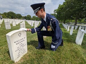 Maj. Steven Rein, Chaplain 11th Wing Operation Group, salutes the gravesite of a fallen Veteran at Arlington National Cemetery, Arlington, Virginia, June 11, 2021. The Arlington National Cemetery Chaplain Corps, under the 11th Wing Operation Group at Joint Base Anacostia-Bolling, serves at Arlington National Cemetery. The Chaplains provide religious rites and services for Air Force members and their families (U.S. Air Force photo by Brian Nestor)