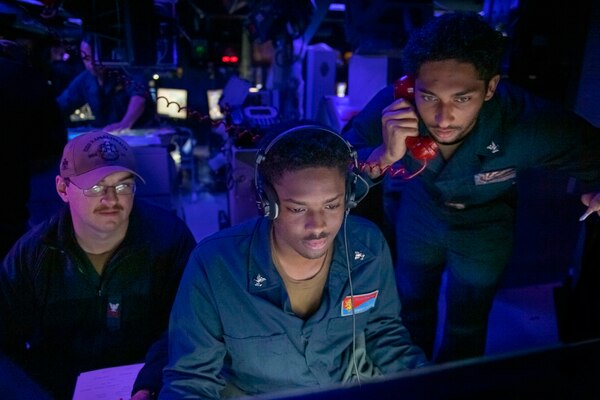 Sailors assigned to the Arleigh Burke-class guided-missile destroyer USS Rafael Peralta (DDG 115) identify a target for Naval Surface Fire Support during Exercise Talisman Sabre 21