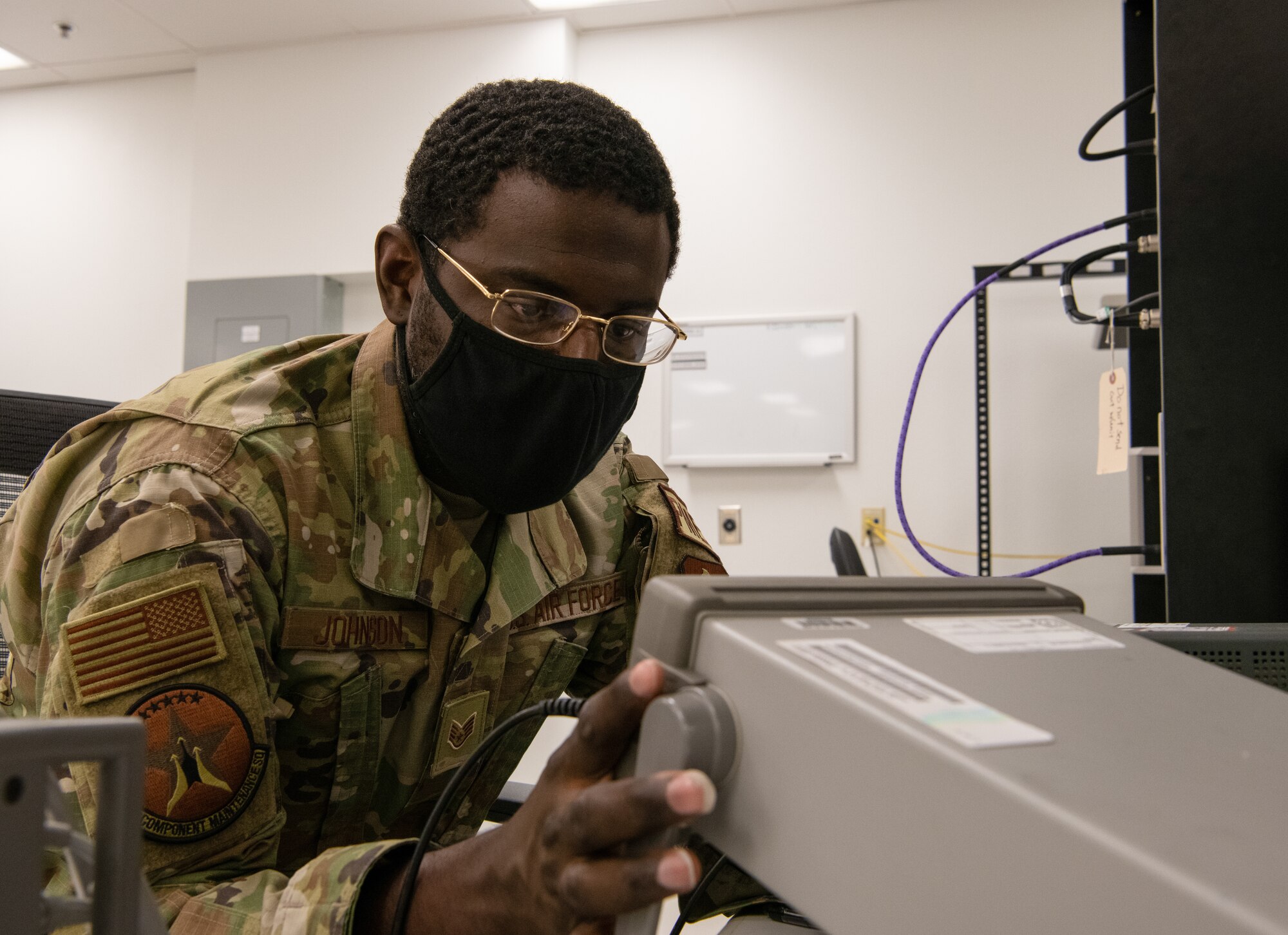 Staff Sgt. Dantes Johnson, 56th Component Maintenance Squadron precision measurement equipment lab technician, calibrates a frequency counter July 1, 2021, at Luke Air Force Base, Arizona. Frequency counters measure the number of cycles of oscillation, or pulses per second in a periodic electronic signal. PMEL technicians ensure accurately calibrated equipment to support the needs of the Air Force, sister services and allied forces.