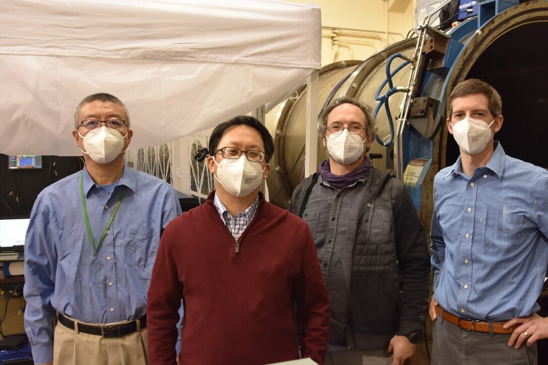 Personnel with Spectral Energies, LLC are pictured at Arnold Engineering Development Complex Hypervelocity Wind Tunnel 9 in White Oak, Maryland. A Small Business Innovation Research program funded to Spectral Energies allowed a previously-demonstrated diagnostic used to measure velocities within hypersonic wind tunnels to be performed at an increased data rate. The SBIR project was successfully demonstrated at Tunnel 9. Pictured from left are Dr. Naibo Jiang, Dr. Paul Hsu, Dr. Mikhail Slipchenko and Dr. Steven Grib. (U.S. Air Force photo)