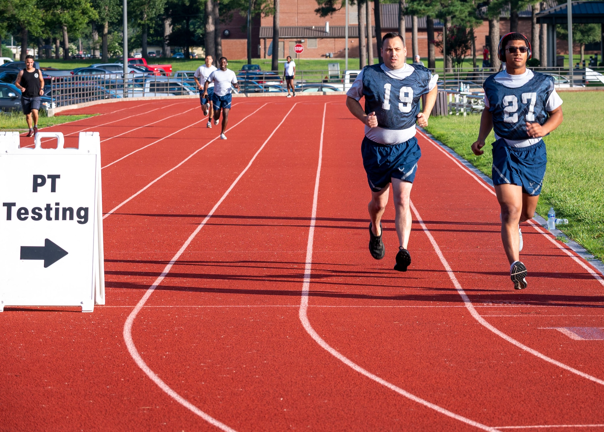 Airmen take the 1.5 mile run component of their fitness assessment at Seymour Johnson Air Force Base, North Carolina, July 13, 2021.