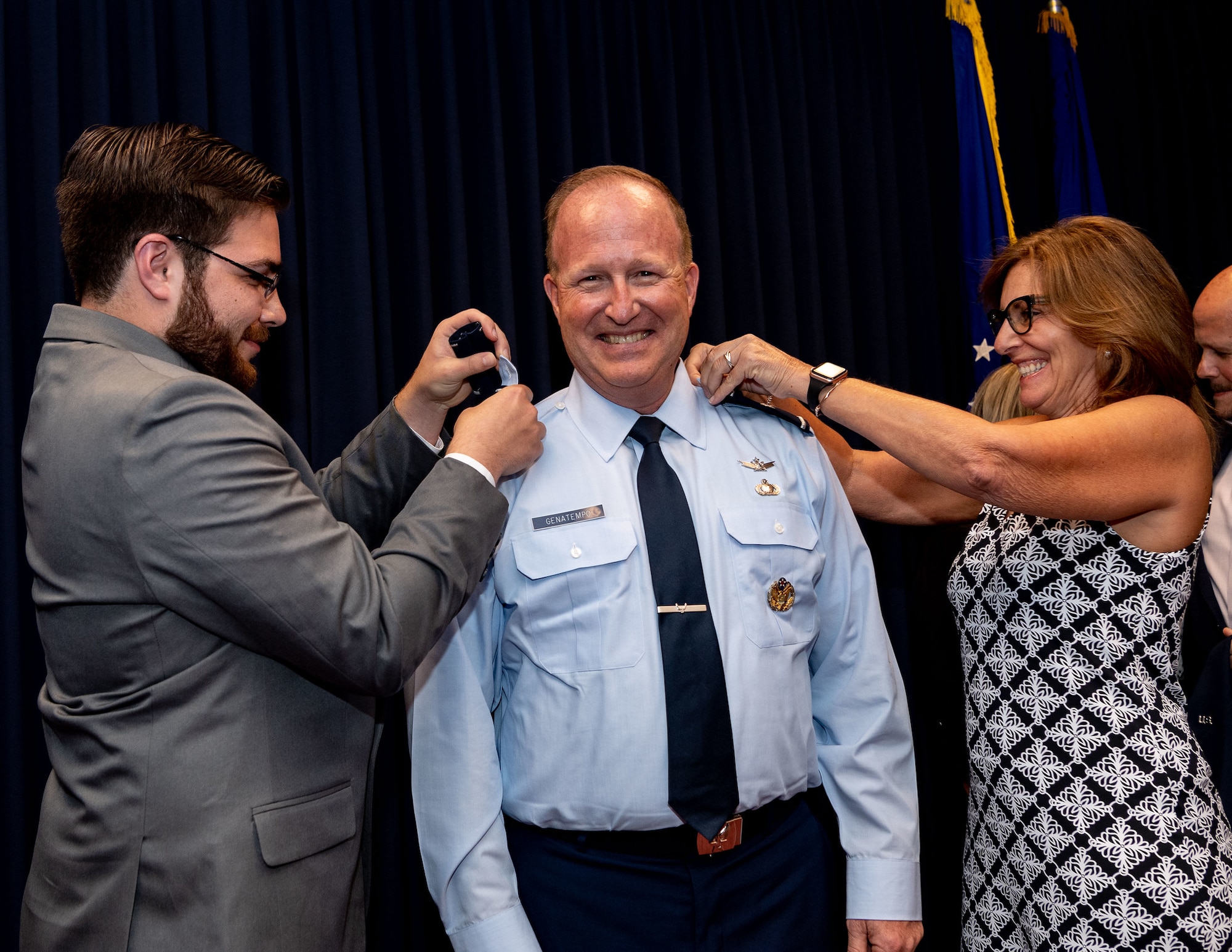 Maj. Gen. Anthony W. Genatempo, Air Force Nuclear Weapons Center commander and Air Force program executive officer for strategic systems, is pinned with the rank of Major General by his son, Rett Genatempo, and cousin, Celeste Mariani, during a promotion celebration at Kirtland Air Force Base, New Mexico, on July 9, 2021. His official promotion date was May 7, but the celebration was delayed to allow family and friends to attend after pandemic restrictions were eased. (U.S. Air Force photo by Allen Winston)