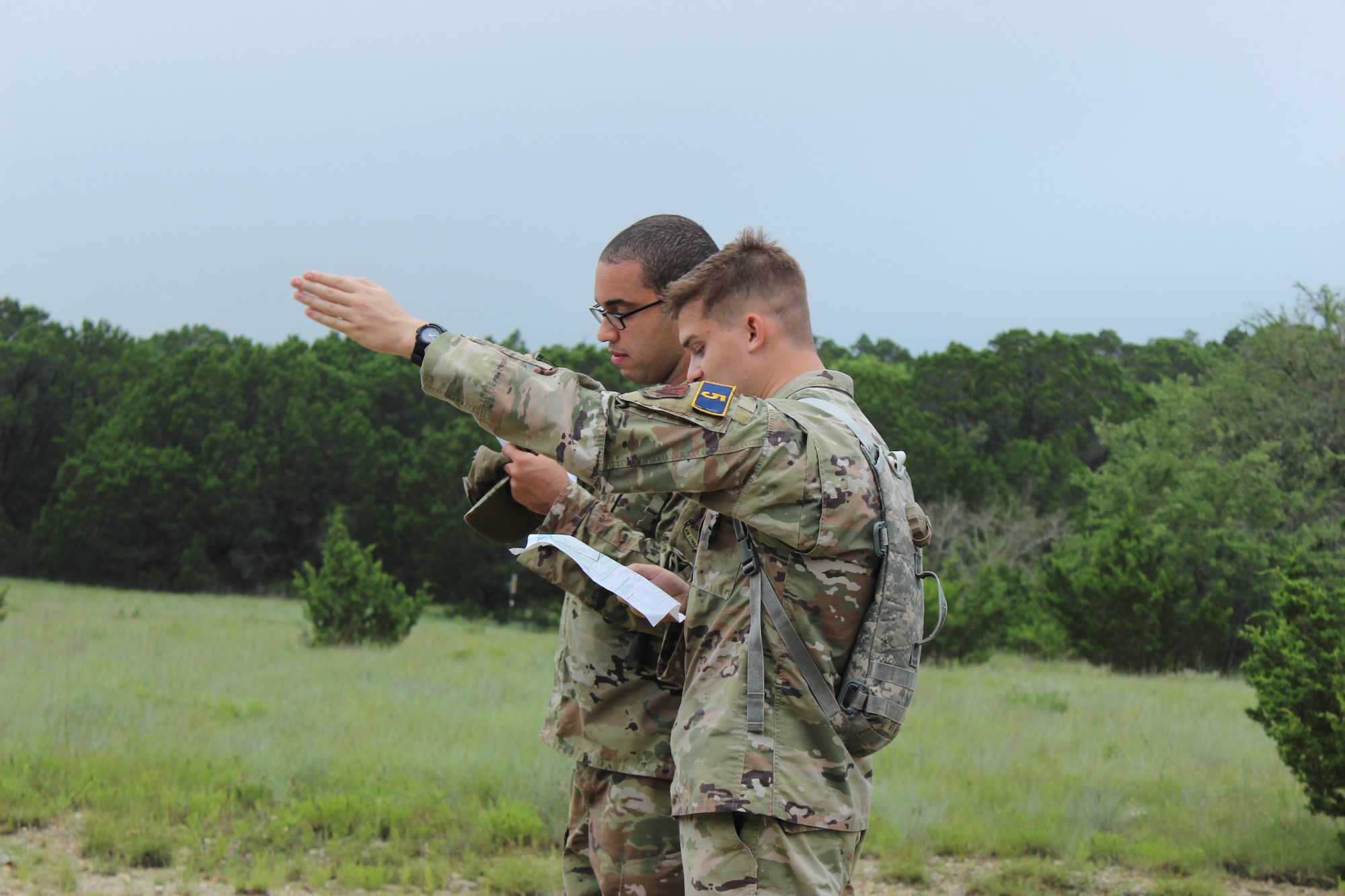 two men looking at a map