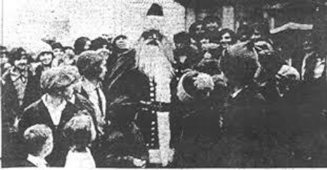 Brig. Gen. J. Tandy Ellis, Kentucky's 26th Adjutant General, dresses as Santa Claus for a crowd, 1926.