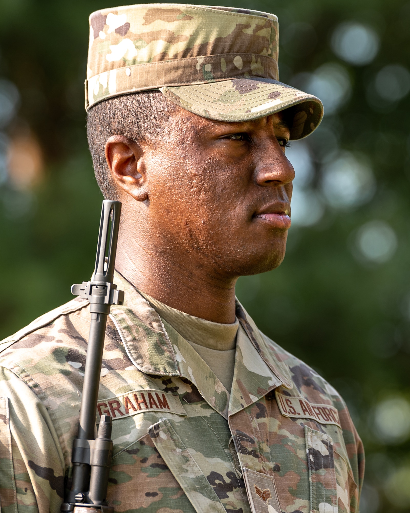 U.S. Air Force Senior Airman Jalen Graham, USAF Honor Guard ceremonial guardsman, stands at attention on Scott Air Force Base, Illinois, July 9, 2021. The USAF Honor Guard led a joint training for different base honor guards including Wright-Patterson AFB, Indiana Air National Guard Base and Scott AFB.(U.S. Air Force Photo by Airman 1st Class Isaac Olivera)
