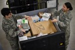 Senior Airman Raina Hornbuckle, 22nd Medical Support Squadron medical logistician journeyman, and Airman 1st Class Ariana Vega, 22nd Medical Group medical logistician apprentice, look through medical supplies at McConnell Air Force Base, Kan., March 11, 2019. Thousands of deliveries like this each year are made possible by the Defense Logistics Agency Troop Support Medical’s Medical Surgical Prime Vendor program named “Best in Class” by the Office of Management and Budget in July 2021.