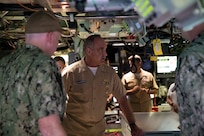 Admiral Chas Richard, Commander, United States Strategic Command, receives a brief in the control room of the Virginia-class fast-attack submarine USS Illinois (SSN 786). Richard visited commands on Guam to see how they fit into the USSTRATCOM mission of deterring strategic attack and employing forces, as directed, to guarantee the security of the nation and its allies.