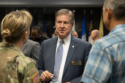 Stan Soderstrom, Civilian Aide to the Secretary of the Army for Indiana, talks with Col. Paige M. Jennings, U.S. Army Financial Management Command commander, and her husband, Larry Jennings, following her assumption of command ceremony at the Maj. Gen. Emmett J. Bean Federal Center in Indianapolis July 15, 2021. CASAs, a vital part of the Army, promote good relations between the Army and the public and advise the secretary on regional issues. (U.S. Army photo by Mark R. W. Orders-Woempner)