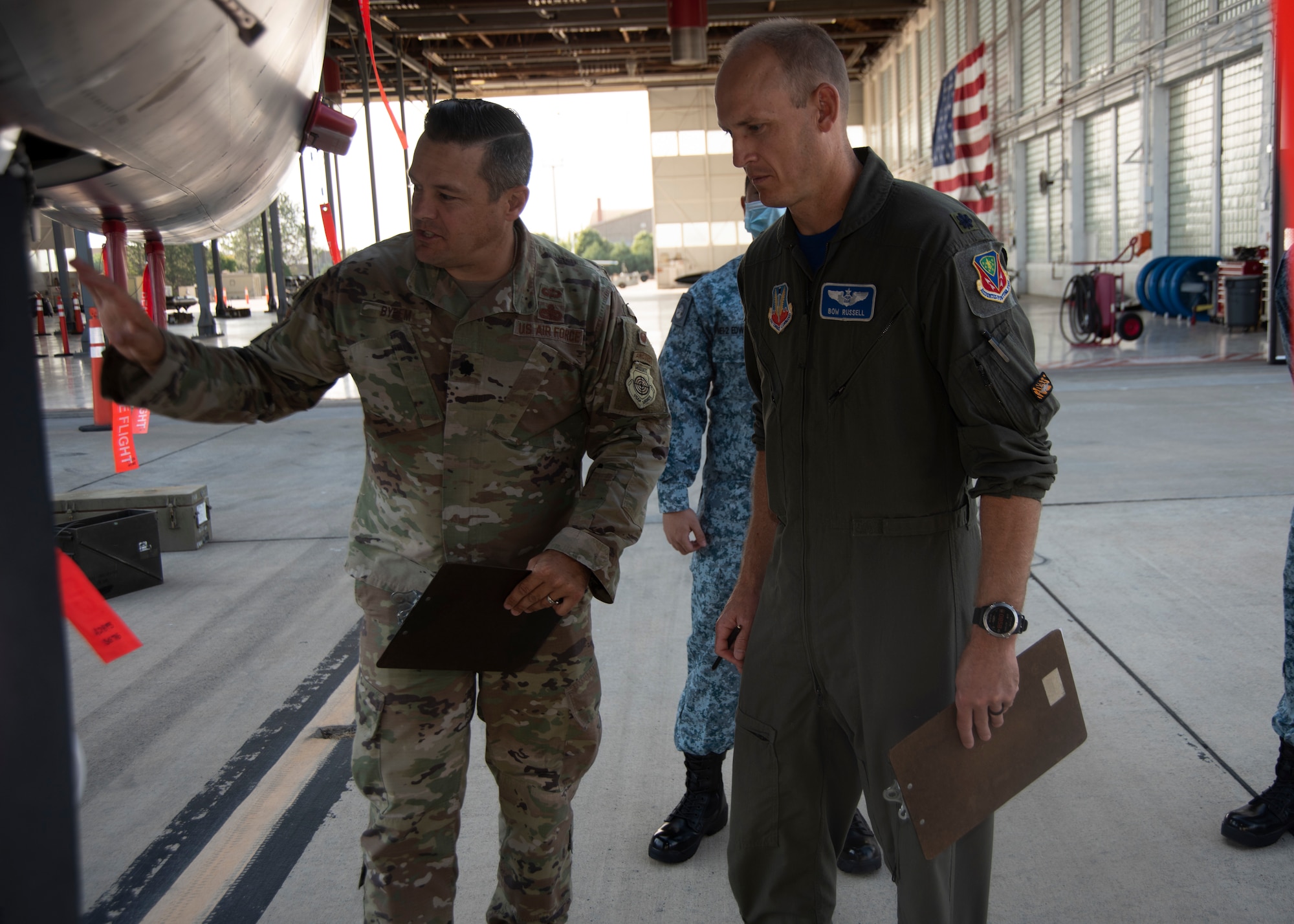 Two Airmen inspect a F-15E Strike Eagle.