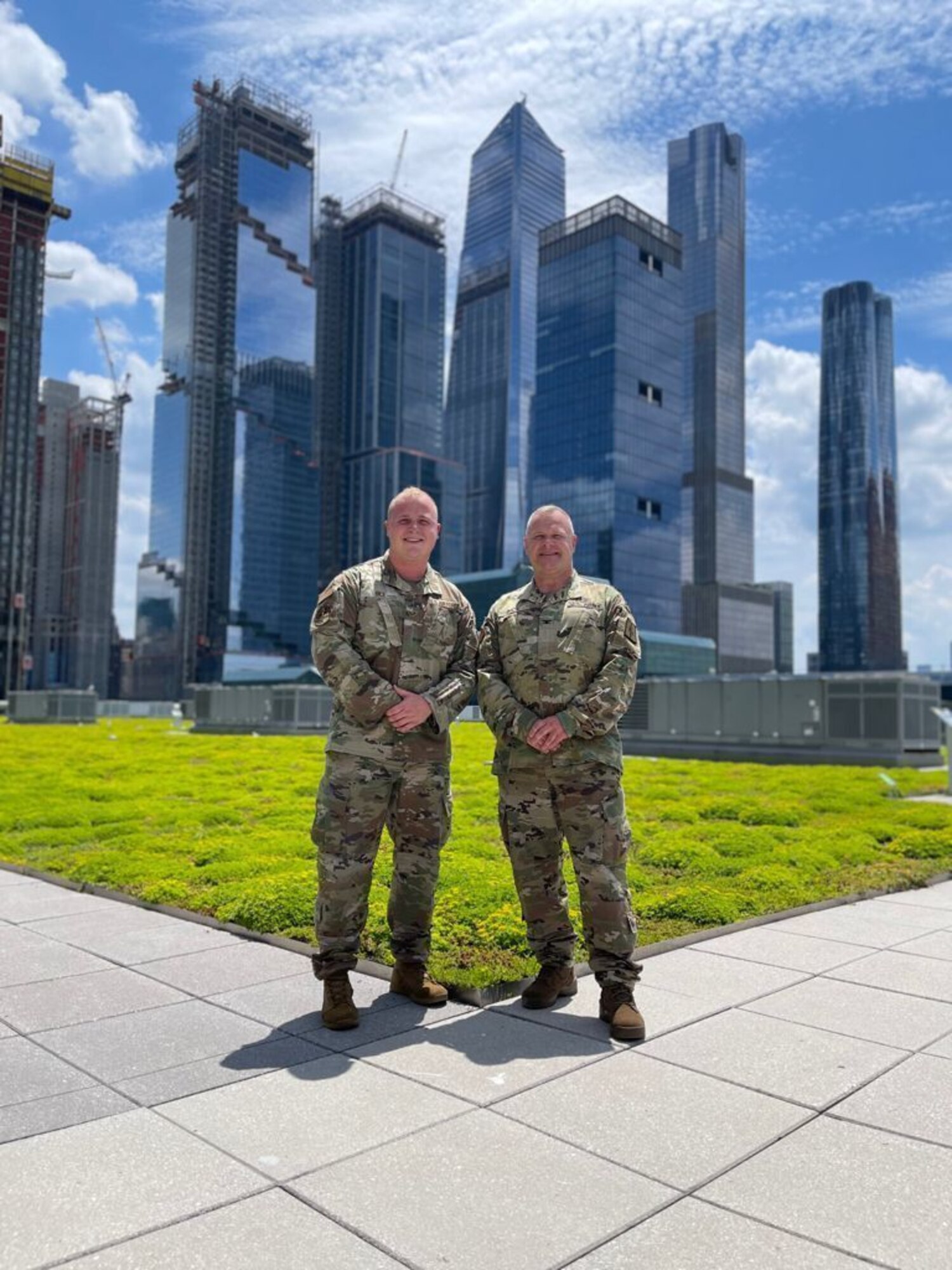 U.S. Air Force Senior Airmen Dlyan Bice, left, poses for a photo with his father, U.S. Army Colonel Michael T. Bice, both with the New York National Guard, on the garden roof top at the Jacob K Javits Center, Manhattan, NY on July 2, 2021.