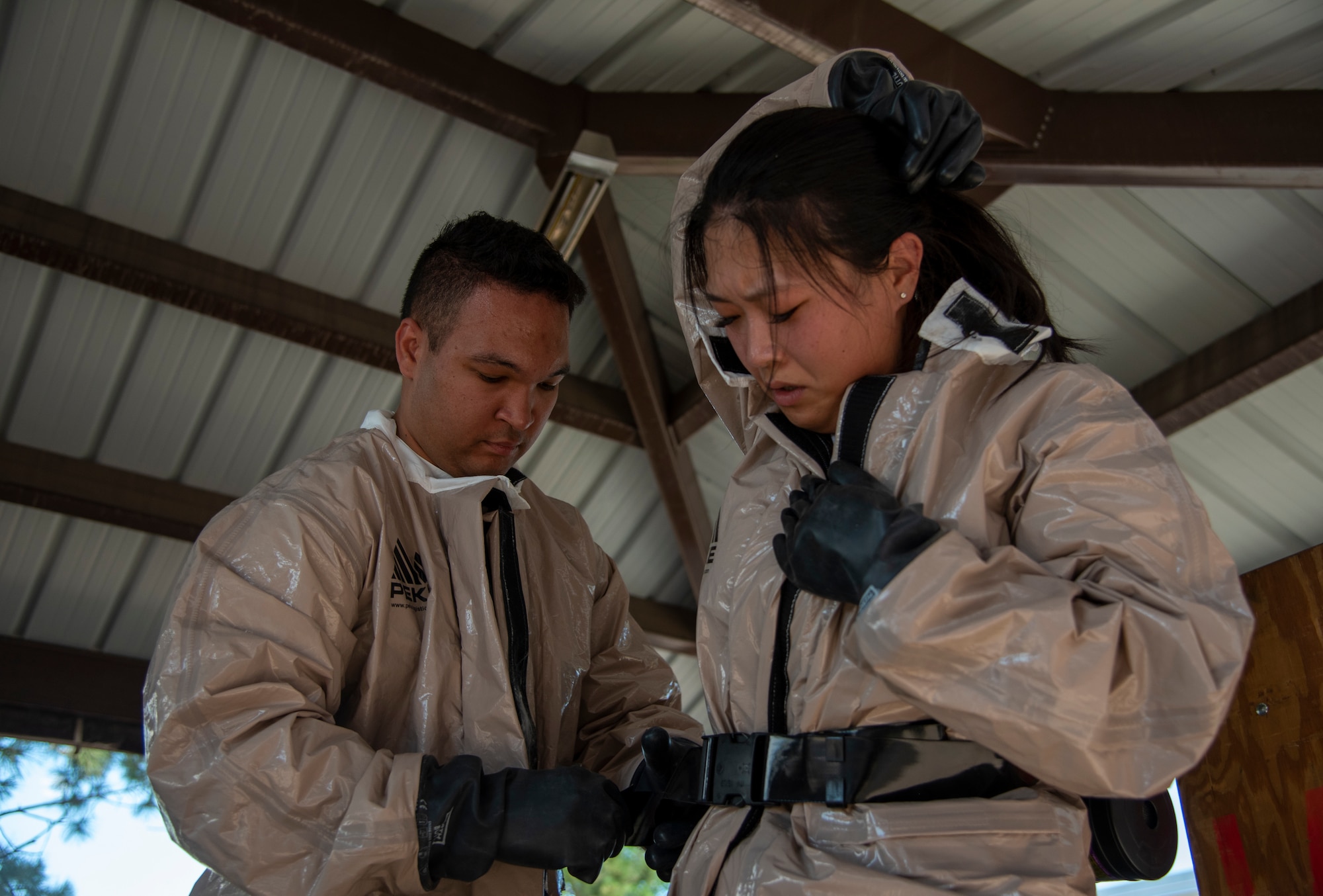 Airmen put on PAPR suits