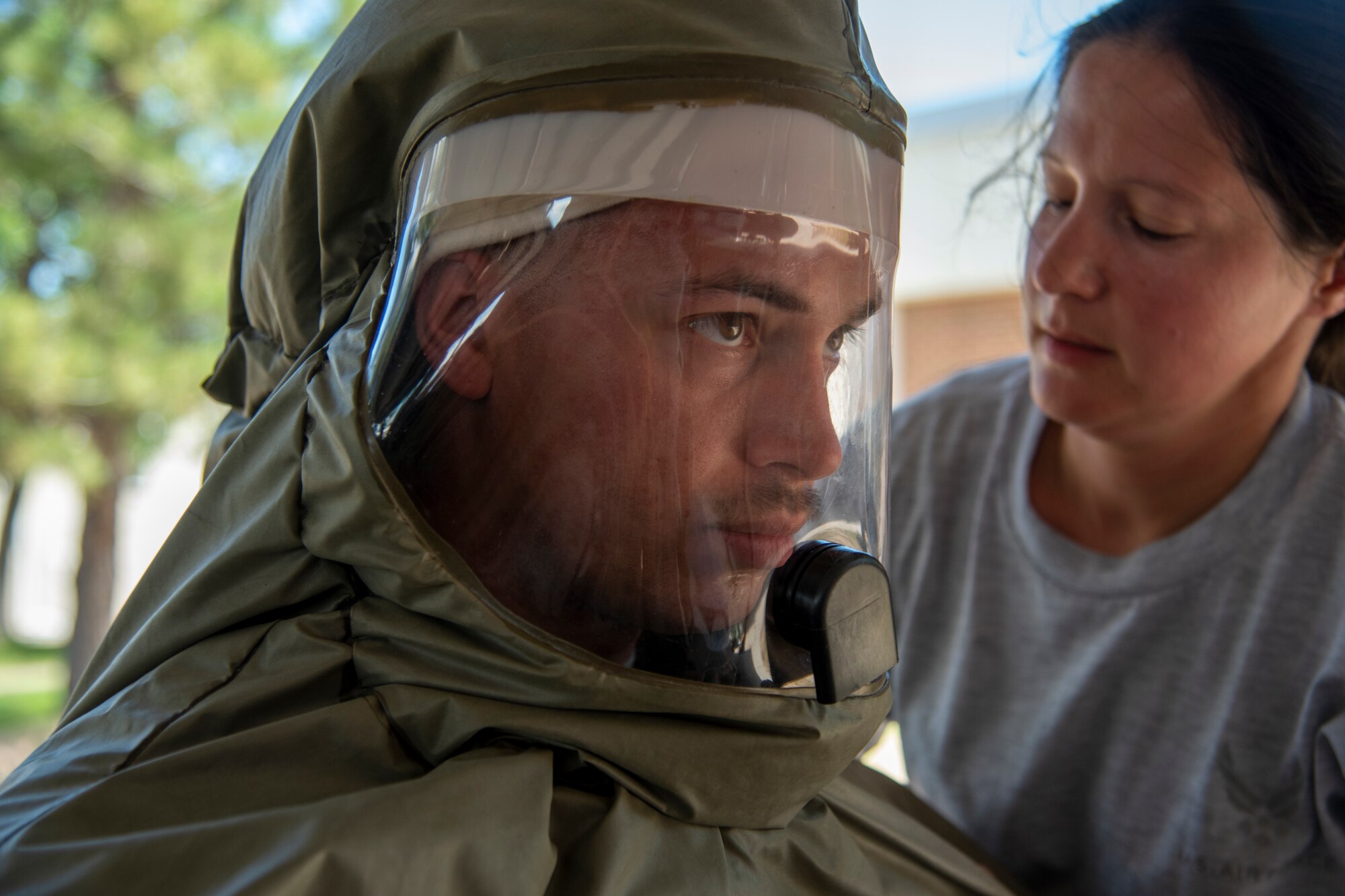 Airmen put on PAPR suits