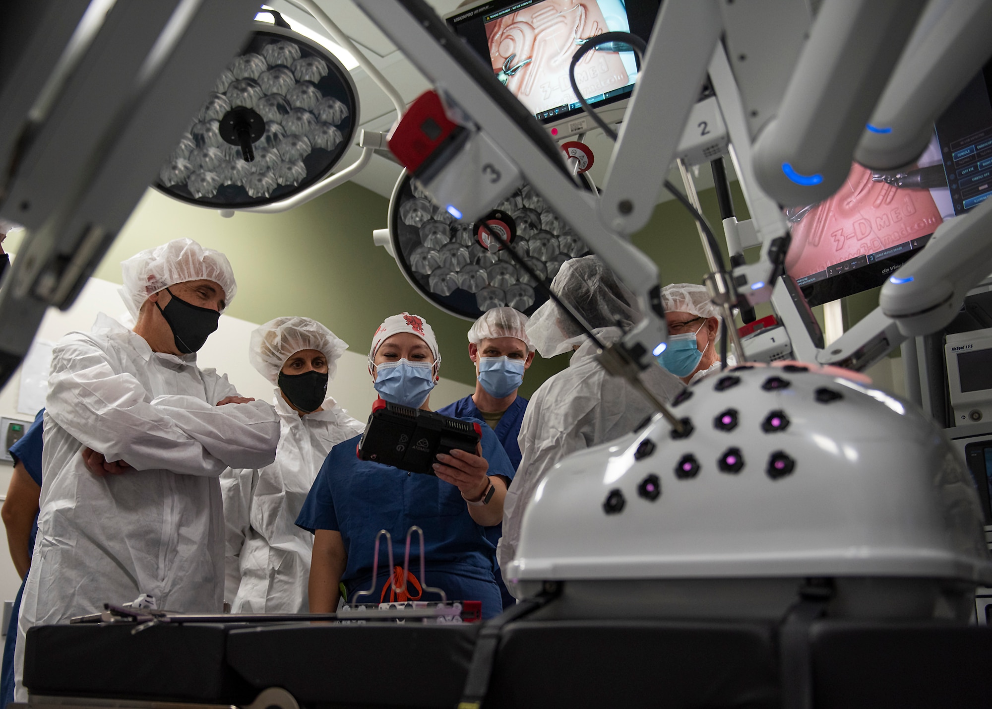 U.S. Air Force, U.S. Space Force and Air Combat Command surgeons general and chief medical enlisted leadership receive a brief on the Di Vinci surgical robot