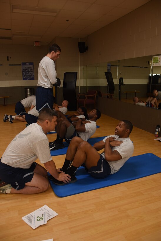 People performing sit-ups.