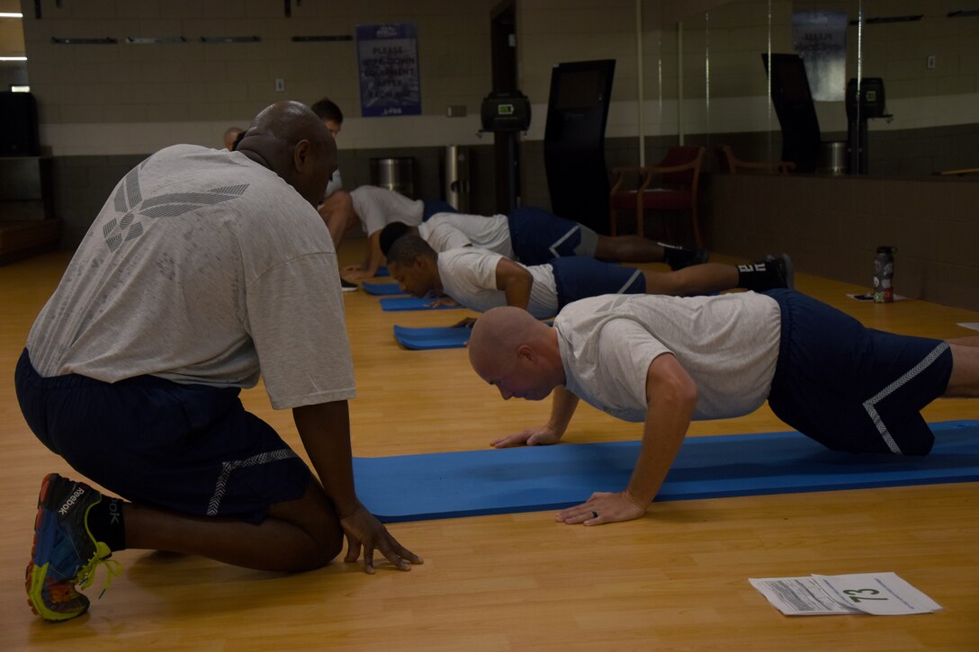 People performing sit-ups.