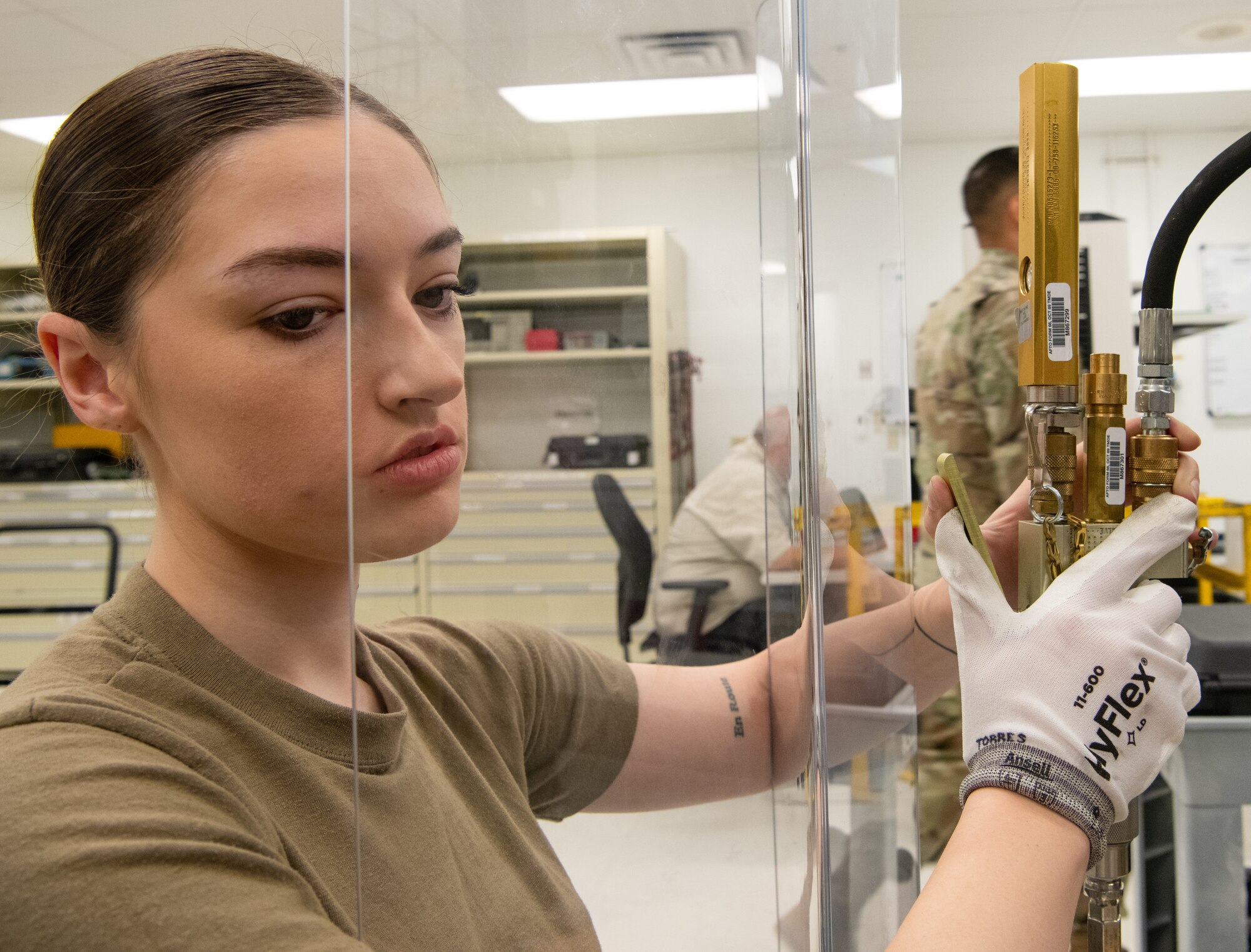 Airman 1st Class Jasmin Torres, 56th Component Maintenance Squadron precision measurement equipment lab technician, calibrates a tire inflator kit July 1, 2021, at Luke Air Force Base, Arizona. Maintainers use tire inflator kits to service tires on government vehicles as well as aircraft tires. PMEL technicians ensure accurately calibrated equipment to support the needs of the Air Force, sister services and allied forces.