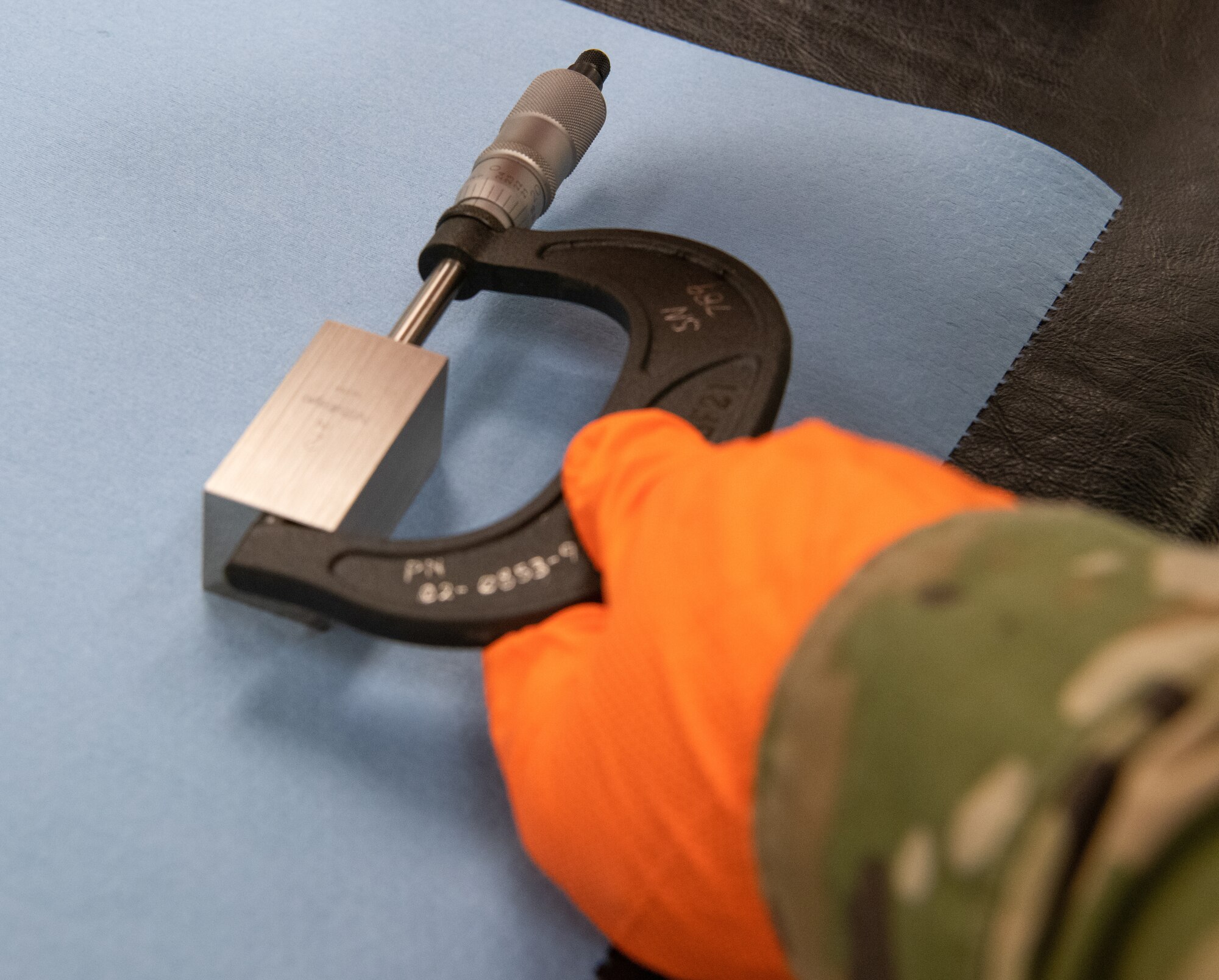 Staff Sgt. Jordan Barker, 56th Component Maintenance Squadron precision measurement equipment lab technician, calibrates a micrometer July 1, 2021, at Luke Air Force Base, Arizona. A micrometer is a gauge that can make extraordinarily precise measurements within 1/1000 of an inch. Exact measurements are necessary because imprecise calibrations of even the smallest of spaces between objects can lead to catastrophic malfunctions. PMEL technicians ensure accurately calibrated equipment to support the needs of the Air Force, sister services and allied forces.