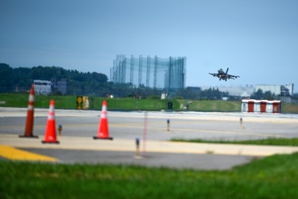 An F-16 Fighting Falcon lands on the flightline at Kunsan Air Base, Republic of Korea, July 15, 2021. The last of the 8th Fighter Wing jets returned home after supporting a month-long multinational training event at Red Flag-Alaska 21-2, while practicing Agile Combat Employment tactics. (U.S. Air Force photo by Senior Airman Suzie Plotnikov)