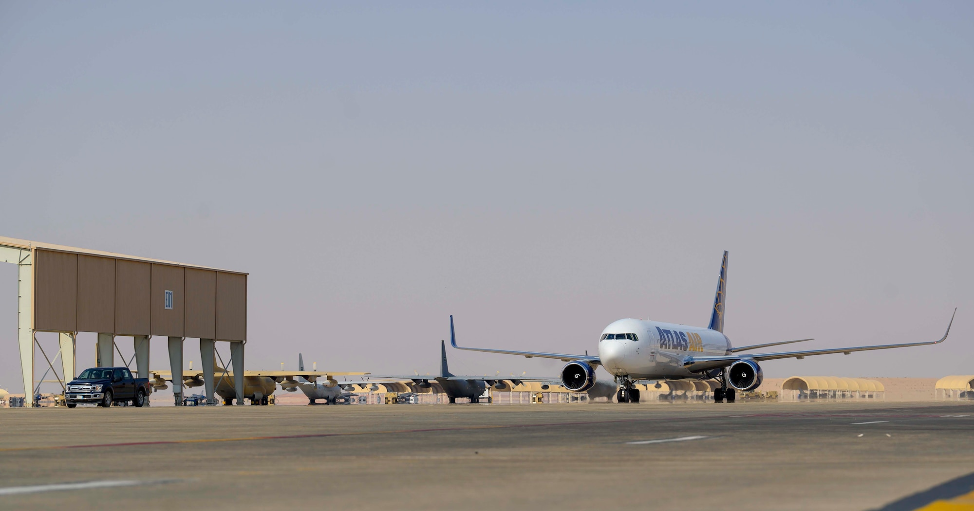 An aircraft carrying members of the District of Columbia Air National Guard’s 113th Wing, known as the “Capital Guardians,” taxis on the flight line upon arrival at Prince Sultan Air Base, Kingdom of Saudi Arabia, July 11, 2021. The wing deployed a contingent of U.S. Air Force F-16 Fighting Falcons to PSAB to reinforce the base’s defensive capabilities, provide operational depth, and support U.S. Central Command operations in the region. (U.S. Air Force Photo by Senior Airman Samuel Earick)