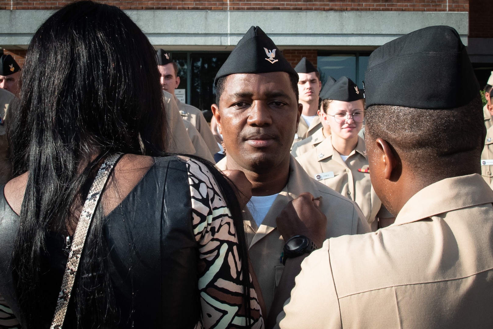 A Sailor serving aboard Naval Hospital Cherry Point, right, and the wife of Hospital Corpsman Second Class Abubakarr Daramy pin the rank of Petty Officer Second Class upon his collar during a frocking ceremony held aboard Marine Corps Air Station Cherry Point on Friday, July 16th.

The frocking ceremony, a tradition permitting a service member to wear rank insignia they will advance to prior to their official promotion, honored the excellence and celebrated the potential of 11 Sailors serving aboard Naval Health Clinic Cherry Point.