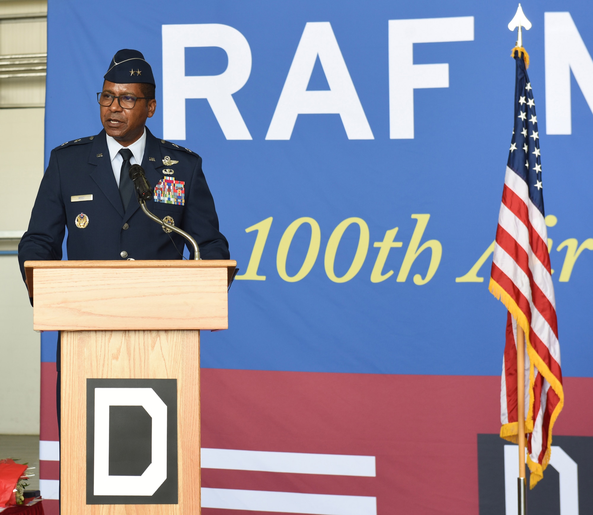 U.S. Air Force Maj. Gen. Randall Reed, left, 3rd Air Force commander, speaks to the audience about the achievements of Col. Troy Pananon during the 100th Air Refueling Wing change of command ceremony at Royal Air Force Mildenhall, England, July 19, 2021. Pananon relinquished command of the 100th ARW to Col. Gene Jacobus. (U.S. Air Force photo by Karen Abeyasekere)