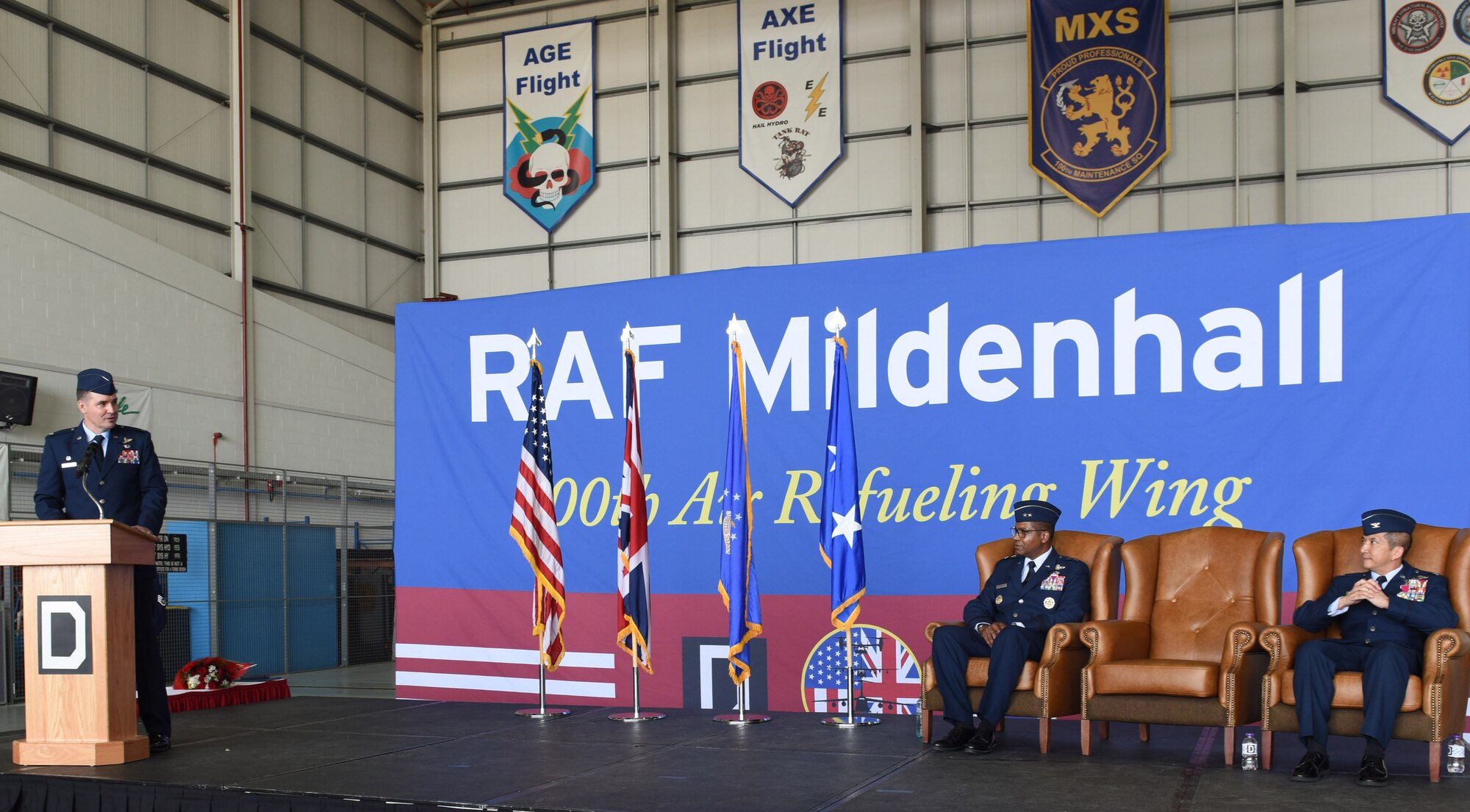 U.S. Air Force Col. Gene Jacobus, left, 100th Air Refueling Wing commander, gives a speech at the 100th ARW change of command ceremony at Royal Air Force Mildenhall, England, July 19, 2021. Jacobus was previously vice commander of the 92nd Air Refueling Wing at Fairchild Air Force Base, Wash. (U.S. Air Force photo by Karen Abeyasekere)