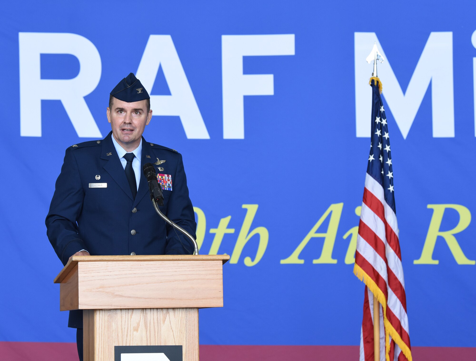 U.S. Air Force Col. Gene Jacobus, 100th Air Refueling Wing commander, gives a speech at the 100th ARW change of command ceremony at Royal Air Force Mildenhall, England, July 19, 2021. Jacobus was previously the vice commander of the 92nd Air Refueling Wing at Fairchild Air Force Base, Wash.(U.S. Air Force photo by Karen Abeyasekere)