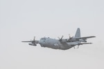 A U.S. Air Force EC-130H Compass Call aircraft, assigned to the 41st Expeditionary Electronic Combat Squadron, takes off in support of a large force employment exercise at Al Dhafra Air Base, United Arab Emirates, July 13, 2021. LFE exercises provide both ADAB and other CENTCOM and coalition forces a unique opportunity to train with international partners in advanced tactics with a broad spectrum of mission sets. (U.S. Air Force photo by Master Sgt. Wolfram M. Stumpf)
