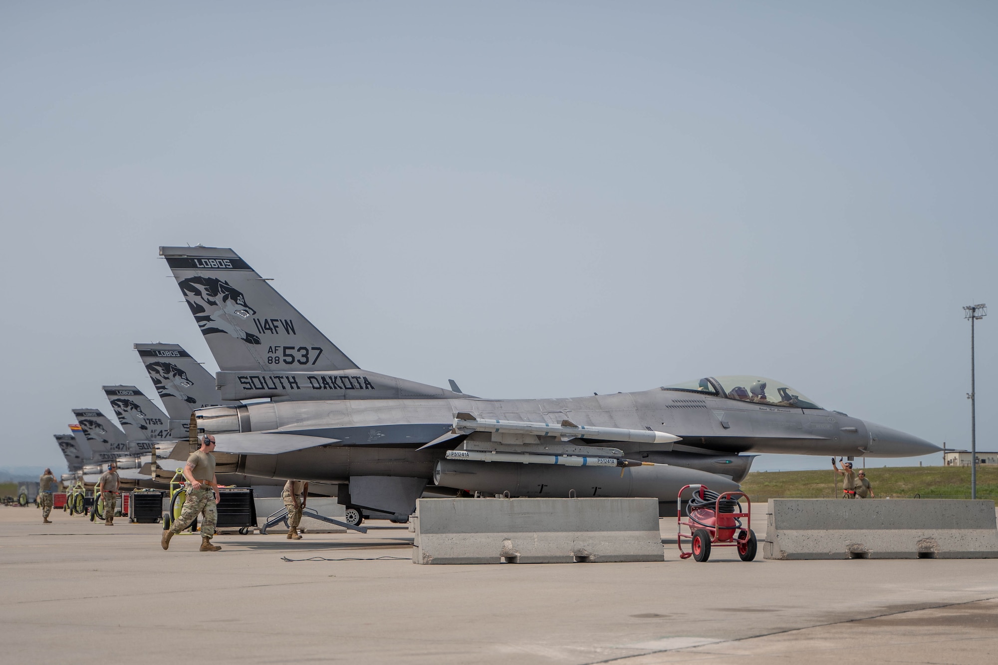 114th Aircraft Maintenance crew chiefs goes through recovery procedures during the F-16 arrival at Ellsworth AFB, S.D. for exercise Combat Raider.
