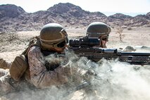 U.S. Marines with 2nd battalion, 1st Marines, assigned to Special Purpose Marine Air-Ground Task Force – Crisis Response – Central Command (SPMAGTF-CR-CC) fire a M240B medium machine gun while training in Jordan, June 23, 2021. SPMAGTF-CR-CC is designed to respond rapidly and efficiently to a wide-range of military operations utilizing aviation, ground, and logistics assets. (U.S. Marine Corps photo by Cpl. Jacob Yost).