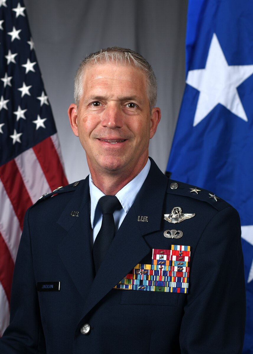 Official photo of two-star general Joel D. Jackson, man smiling at camera in military uniform.