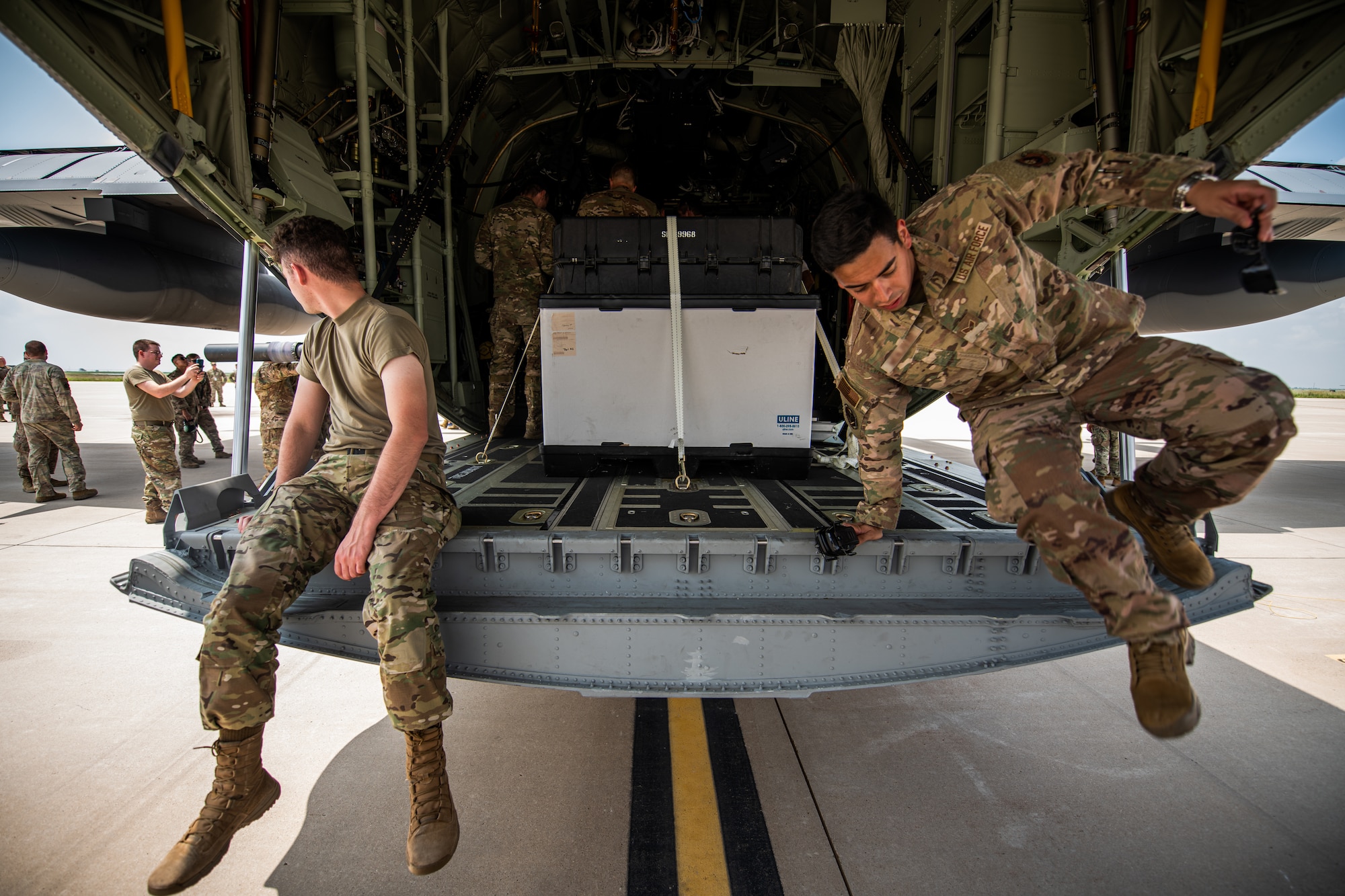27th Special Operations Wing personnel take a tour of the wing’s new AC-130J Ghostrider gunship at Cannon Air Force Base, NM, July 19, 2021. The arrival of Cannon’s AC-130J represents a significant expansion of AC-130 capacity as AFSOC structures for the future of Special Operations force generation models as Air Commandos adapt to near-peer power competition throughout global operations. (U.S. Air Force photo by Staff Sergeant Candin Muniz) (This photo has been altered for security purposes by blurring out squadron identifiers and nametapes)
