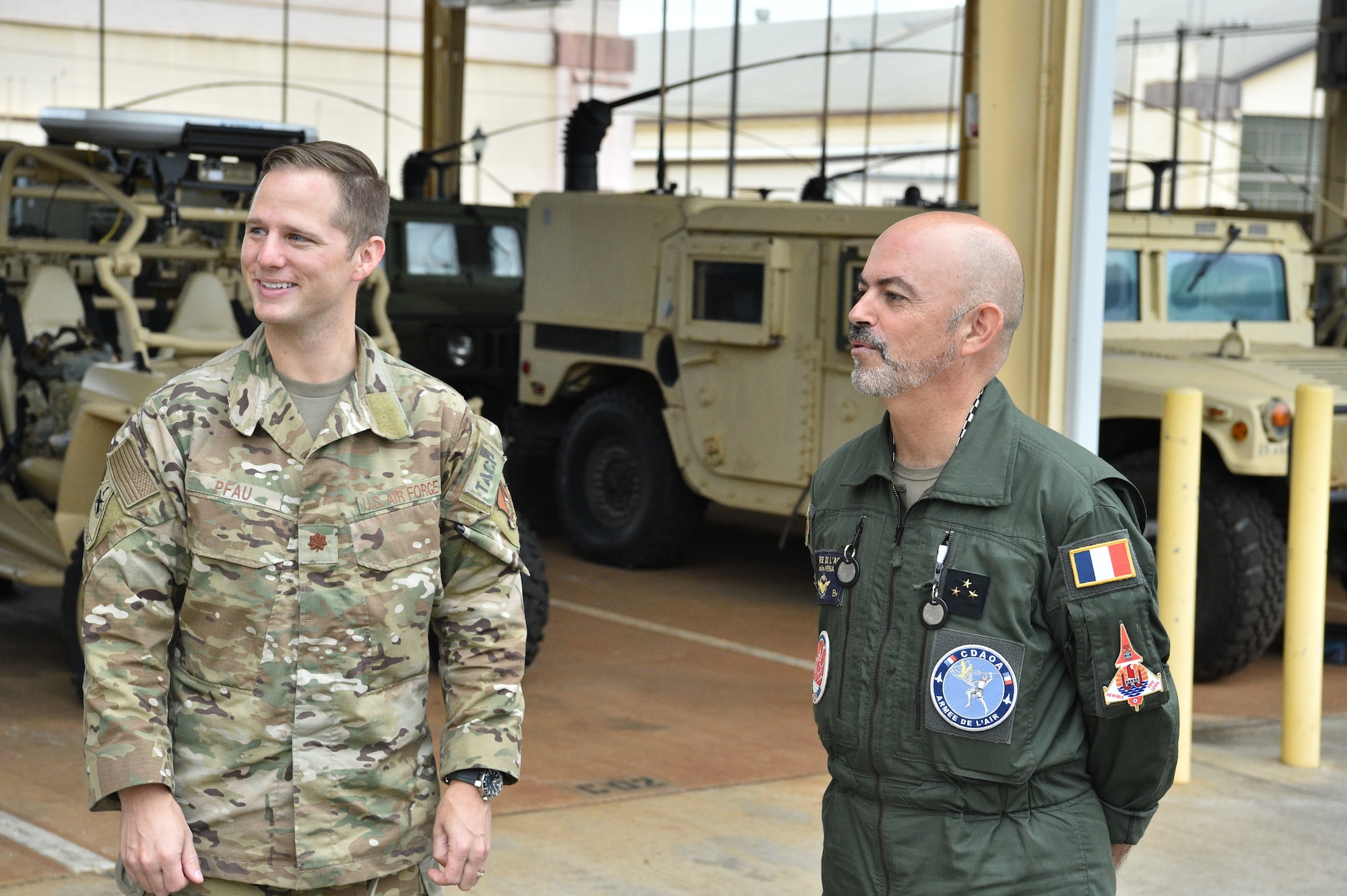 French Air Force Gen. Louis Pena, talks with the members from the 25th Air Support and Operations Squadron to learn about the mission of the Tactical Air Control Party Airmen at Wheeler Army Airfield, Hawaii, June 30, 2021. Pena was briefed on the capabilities of the 25th ASOS and given a demonstration of the Polaris MRZR, a multi-terrain vehicle used by TACP Airmen. (U.S. Air Force photos by 1st Lt. Benjamin Aronson)