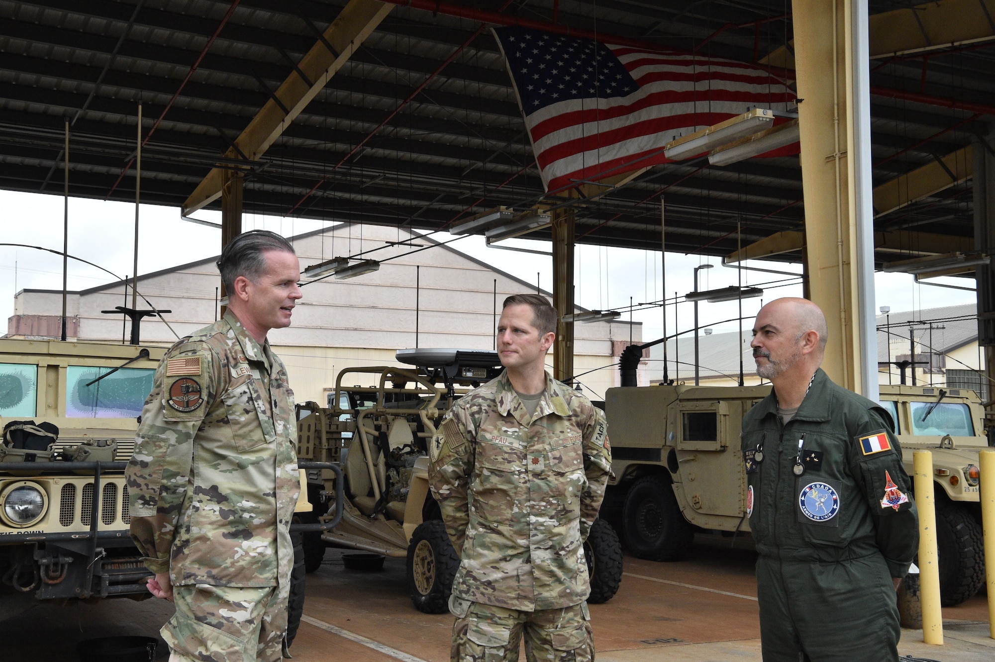 French Air Force Gen. Louis Pena, talks with the members from the 25th Air Support and Operations Squadron to learn about the mission of the Tactical Air Control Party Airmen at Wheeler Army Airfield, Hawaii, June 30, 2021. Pena was briefed on the capabilities of the 25th ASOS and given a demonstration of the Polaris MRZR, a multi-terrain vehicle used by TACP Airmen. (U.S. Air Force photos by 1st Lt. Benjamin Aronson)