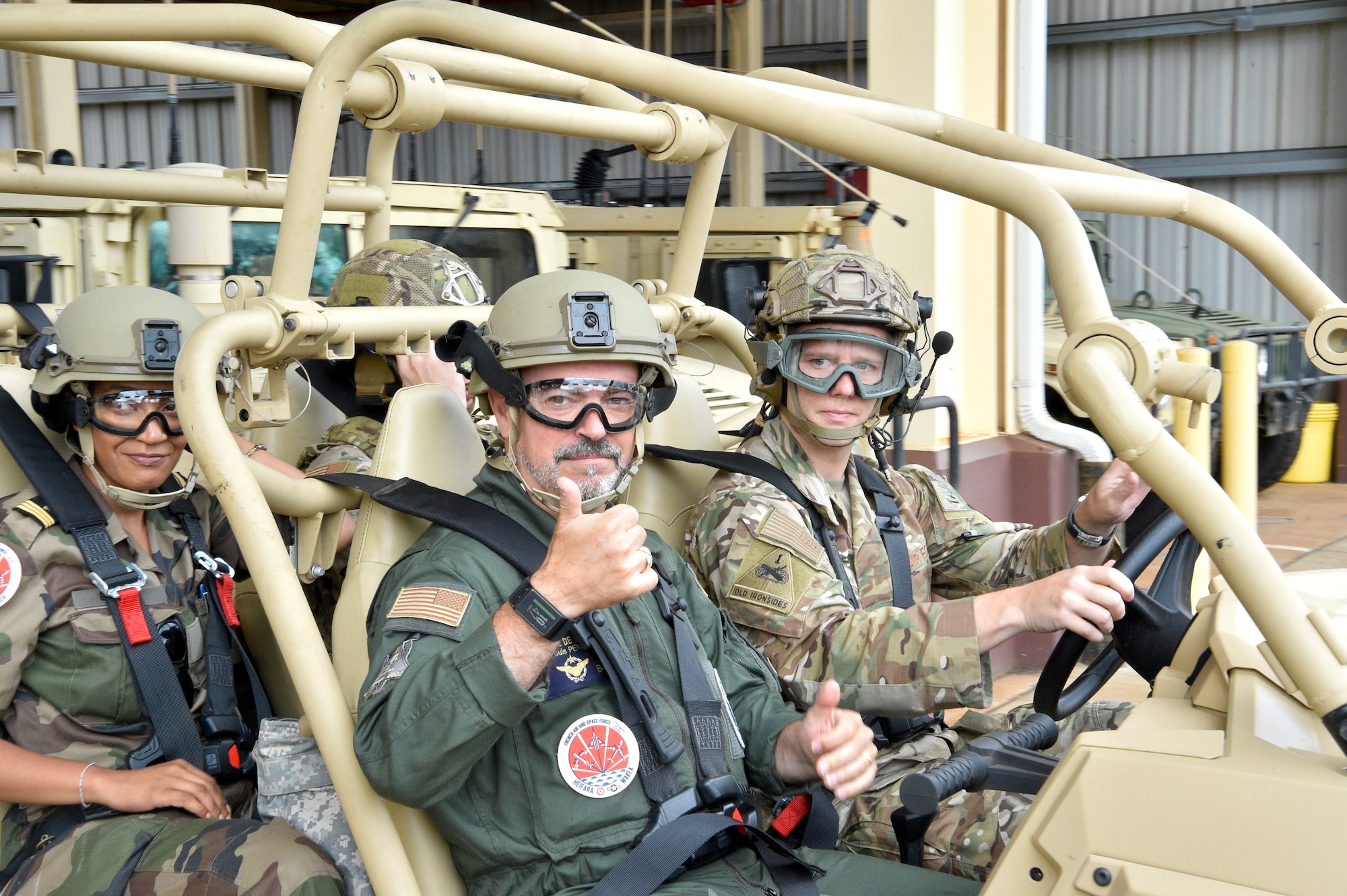 French Air Force Gen. Louis Pena, talks with the members from the 25th Air Support and Operations Squadron to learn about the mission of the Tactical Air Control Party Airmen at Wheeler Army Airfield, Hawaii, June 30, 2021. Pena was briefed on the capabilities of the 25th ASOS and given a demonstration of the Polaris MRZR, a multi-terrain vehicle used by TACP Airmen. (U.S. Air Force photos by 1st Lt. Benjamin Aronson)