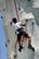 A BMX stuntman jumps over another on a bike