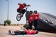 A BMX stuntman jumps over another on a bike