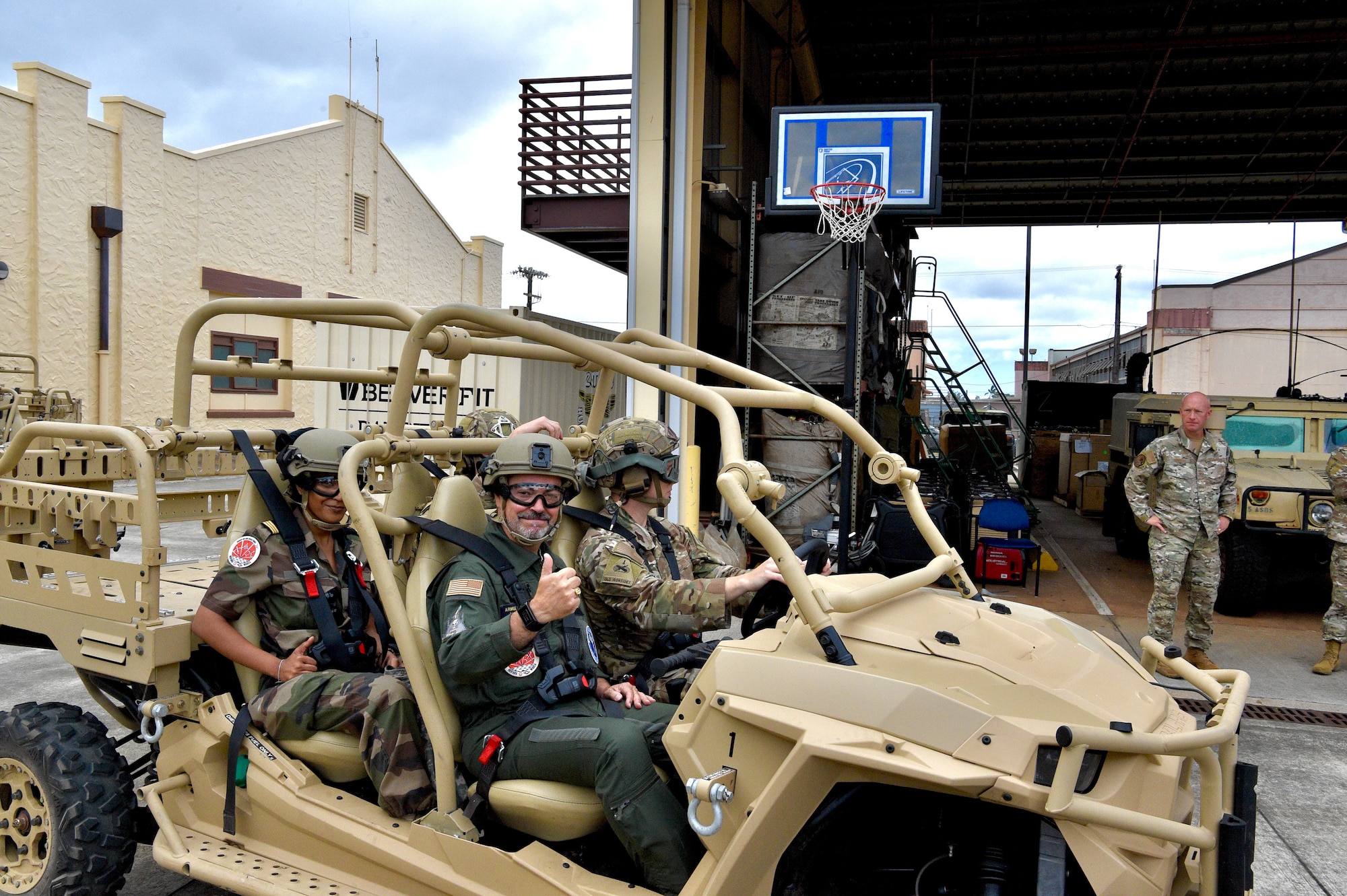 French Air Force Gen. Louis Pena, talks with the members from the 25th Air Support and Operations Squadron to learn about the mission of the Tactical Air Control Party Airmen at Wheeler Army Airfield, Hawaii, June 30, 2021. Pena was briefed on the capabilities of the 25th ASOS and given a demonstration of the Polaris MRZR, a multi-terrain vehicle used by TACP Airmen. (U.S. Air Force photos by 2nd Lt. Benjamin Aronson)