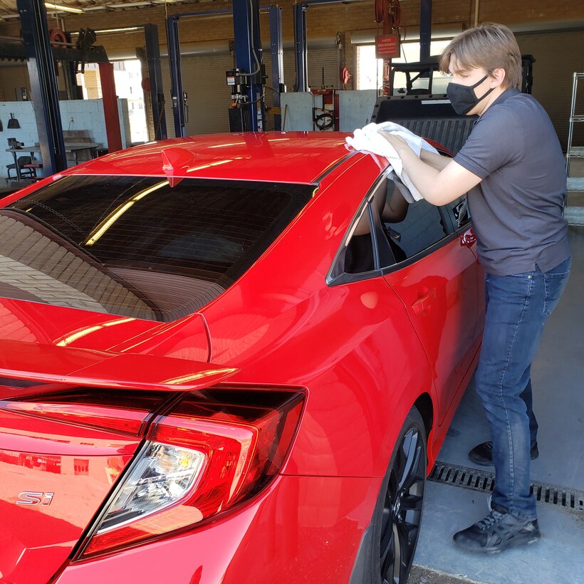 Dennis Parker, Project SEARCH intern, washes a car at the Auto Hobby shop, April 13, 2021, at Luke Air Force Base, Arizona. Project SEARCH is a nine-month program, which offers high school graduates with significant disabilities the opportunity to work side-by-side with Luke AFB Airmen to increase their marketable job skills. The Luke AFB and Project SEARCH partnership offers a unique opportunity for Project SEARCH mentors and mentees to enhance their teamwork and partnership. (Courtesy photo)