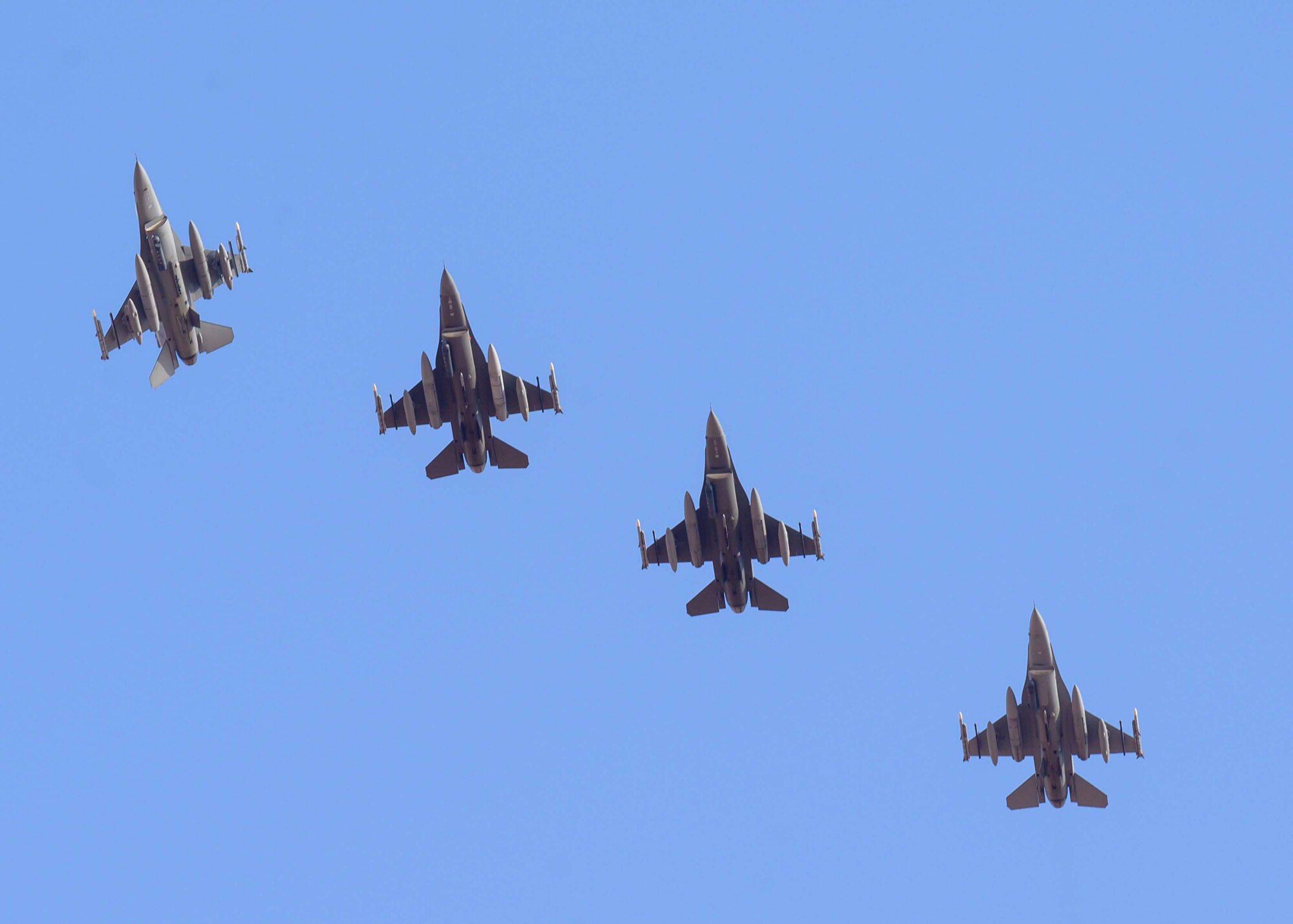 A U.S. Air Force F-16C Fighting Falcon from District of Columbia Air National Guard’s 113th Wing, known as the “Capital Guardians,” banks away from formation in preparation for landing at Prince Sultan Air Base, Kingdom of Saudi Arabia, July 9, 2021. The wing deployed a contingent of F-16s to PSAB to reinforce the base’s defensive capabilities, provide operational depth, and support U.S. Central Command operations in the region. (U.S. Air Force Photo by Senior Airman Samuel Earick)