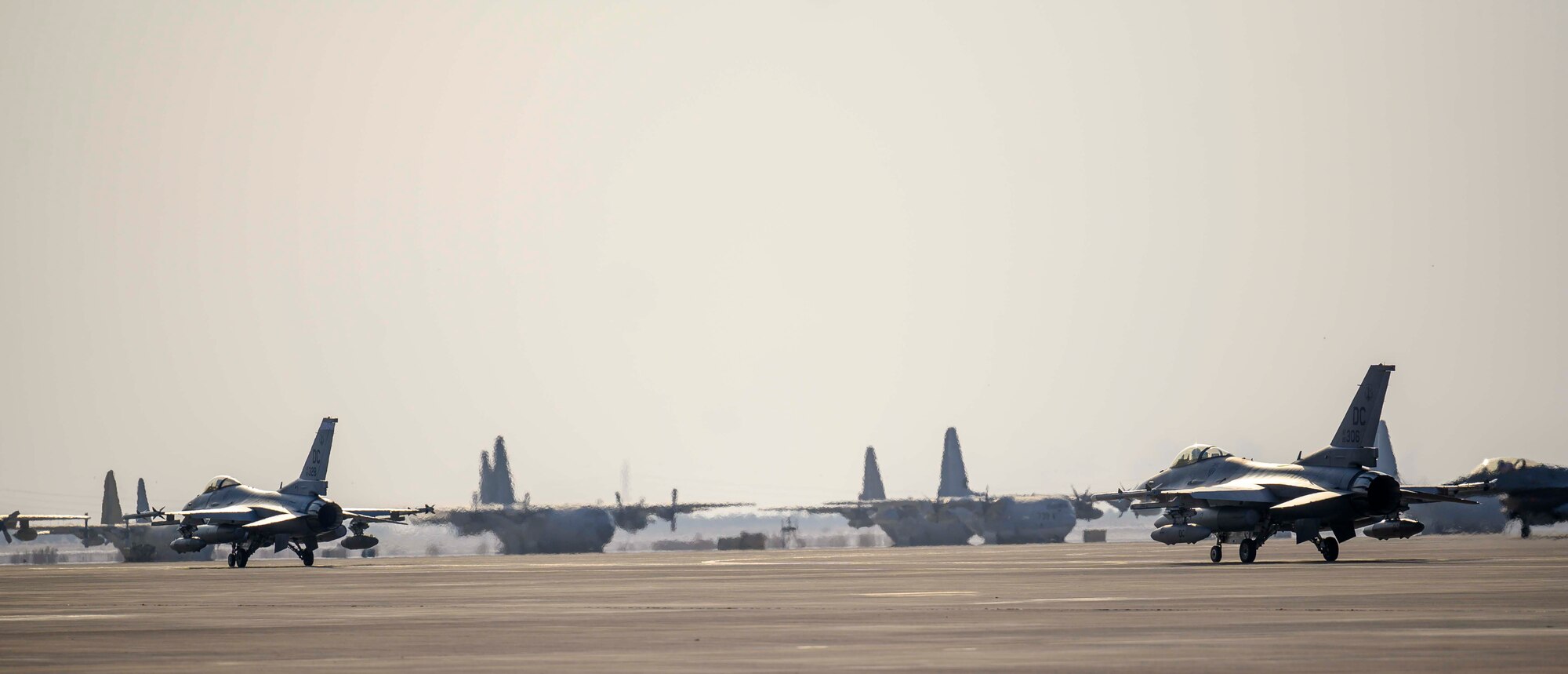 Three U.S. Air Force F-16C Fighting Falcons from District of Columbia Air National Guard’s 113th Wing, known as the “Capital Guardians,”  taxi on the flight line upon arrival at Prince Sultan Air Base, Kingdom of Saudi Arabia, July 9, 2021. The wing deployed a contingent of F-16s to PSAB to reinforce the base’s defensive capabilities, provide operational depth, and support U.S. Central Command operations in the region. (U.S. Air Force Photo by Senior Airman Samuel Earick)