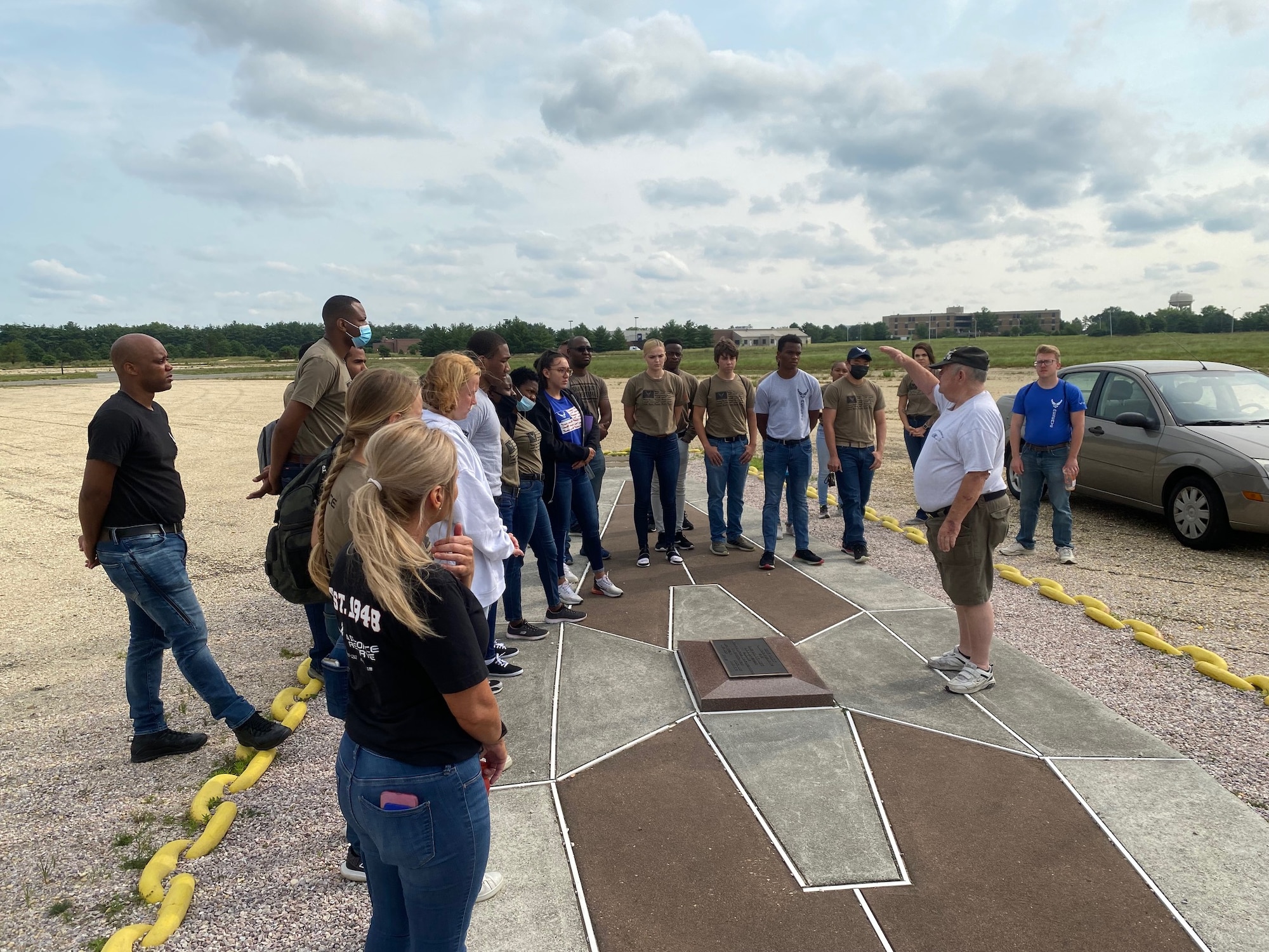 Trainees with the 514th Air Mobility Wing's Developmental Training Flight pose for a photo in Hangar One at Navy Lakehurst. The group toured the legendary Hangar One with Mr. Carl Jablonski, affectionately called Mr. Lakehurst, and Mr. Don Adams from the Navy Lakehurst Historical Society.