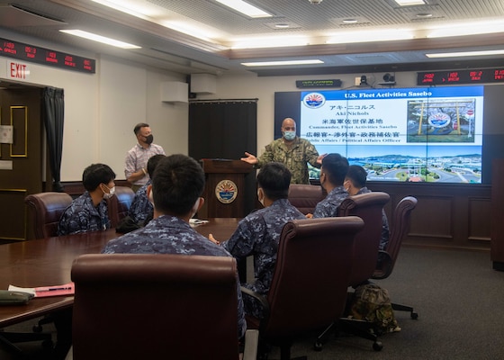 Capt. David Adams, Commander, Fleet Activities Sasebo (CFAS), speaks to National Defense Academy of Japan cadets at CFAS July 14, 2021. The cadets toured CFAS facilities and visited the amphibious transport dock ship USS Green Bay (LPD 20) which was the first ship tour at CFAS since the beginning of the COVID-19 pandemic.