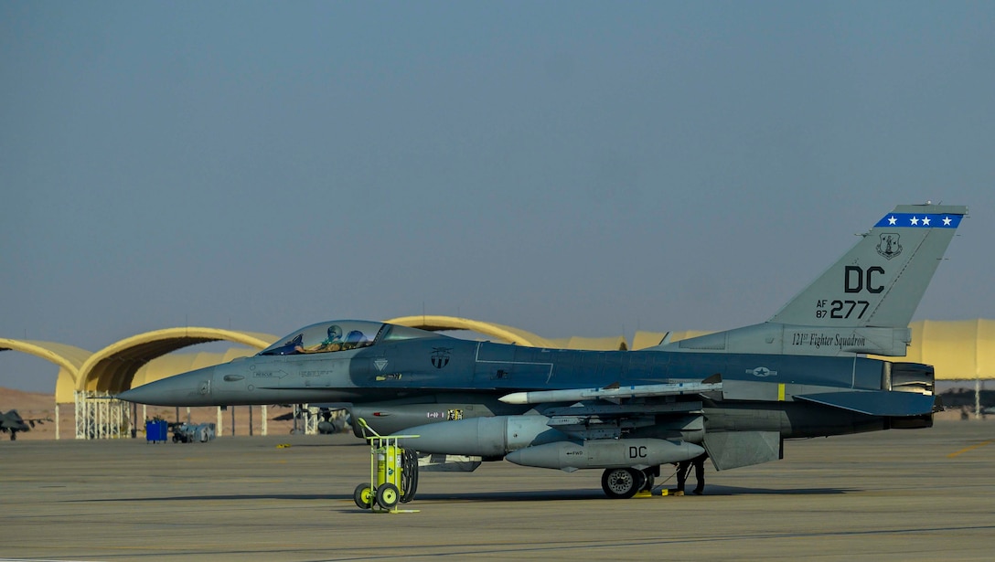 A U.S. Air Force F-16C Fighting Falcon from District of Columbia Air National Guard’s 113th Wing, known as the “Capital Guardians,” sits on the flight line at Prince Sultan Air Base, Kingdom of Saudi Arabia, July 9, 2021. The wing deployed a contingent of F-16s to PSAB to reinforce the base’s defensive capabilities, provide operational depth, and support U.S. Central Command operations in the region. (U.S. Air Force Photo by Senior Airman Samuel Earick)